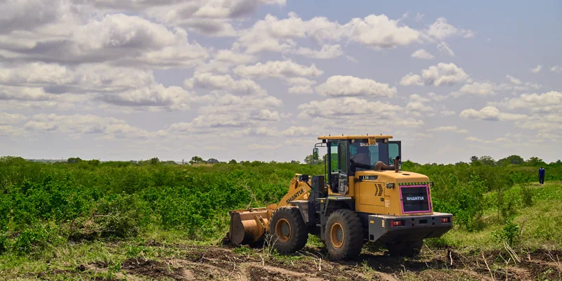 A grader cutting the internal access roads at Furaha Gardens, Gongoni — photographed on site in July 2026